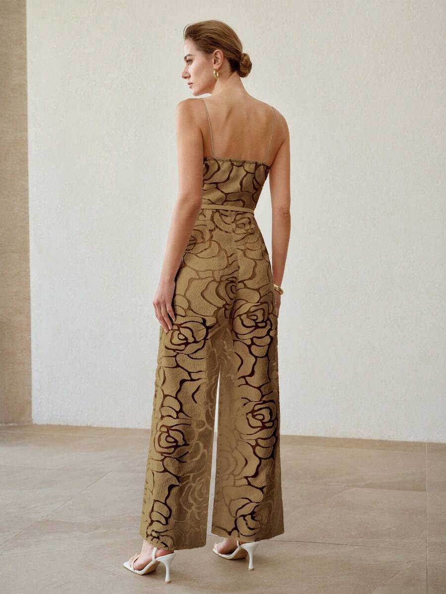 Full front view of khaki rose texture wide-leg jumpsuit styled with white heels and clutch