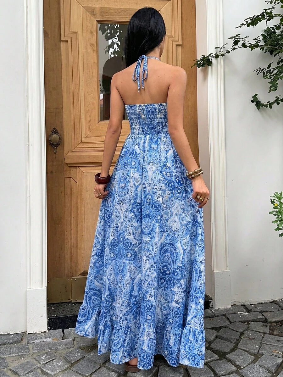 Back view bright blue white paisley maxi dress with halter tie and ruffle hem