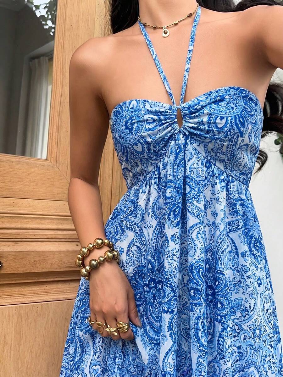 Close-up bright blue white paisley dress with ruched bust and keyhole