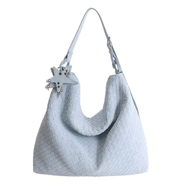Front product view of baby blue woven hobo shoulder bag with star charm and metal rings