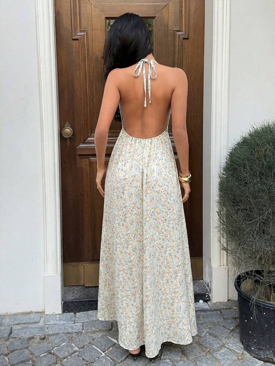 Back view of cream floral backless halter maxi dress
