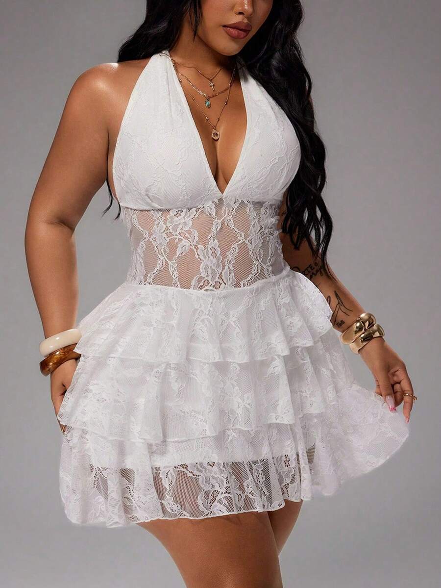 White lace halter mini dress with deep V neckline and sheer waist close view