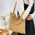 Lifestyle shoulder view of tan crochet woven tote bag with slouchy open top
