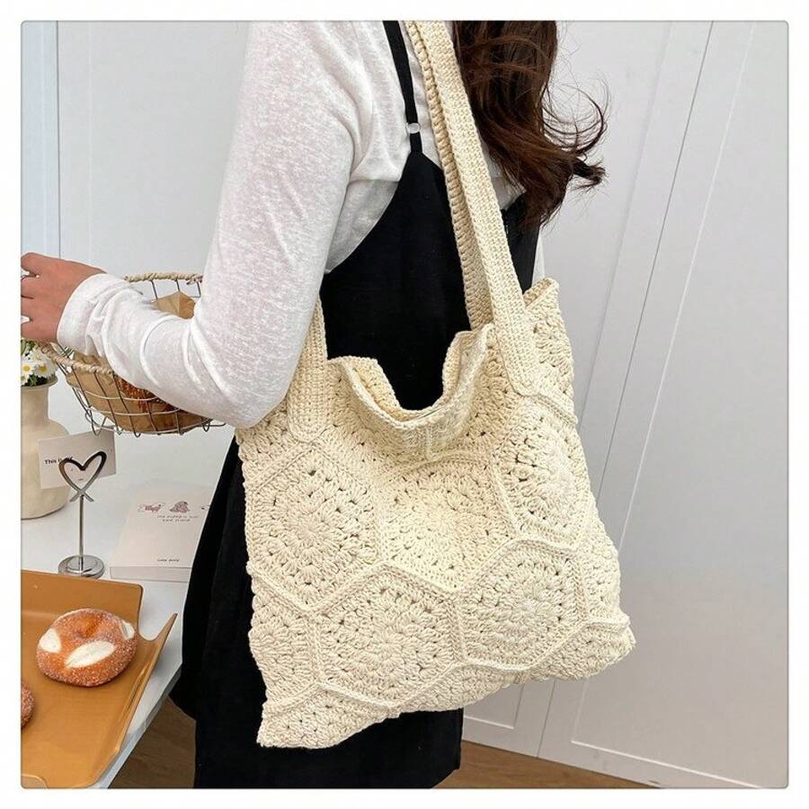 Rear side view of cream crochet shoulder tote bag with floral open knit pattern