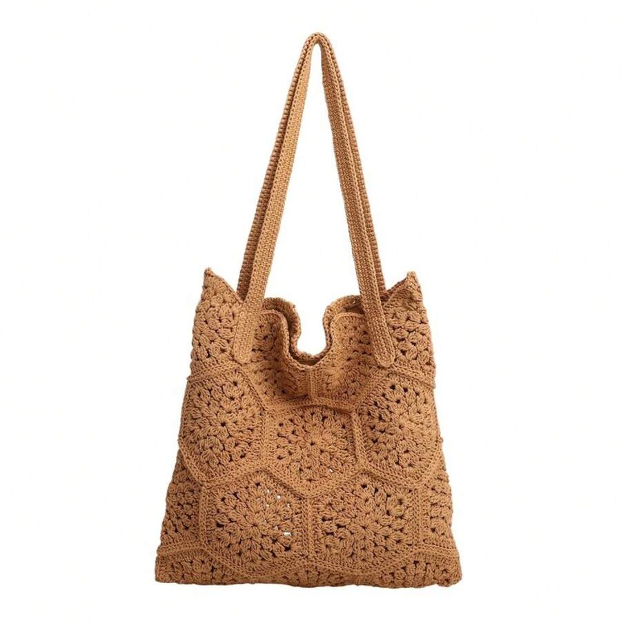 Front studio view of tan crochet tote bag with floral hexagon openwork and long straps