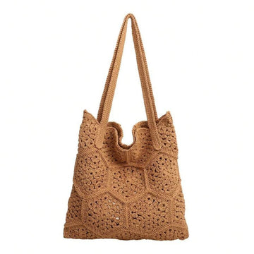 Front studio view of tan crochet tote bag with floral hexagon openwork and long straps