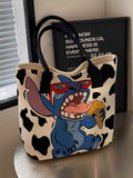Cream tote bag with black cow spots and black handles showing cartoon Stitch in red sunglasses eating ice cream