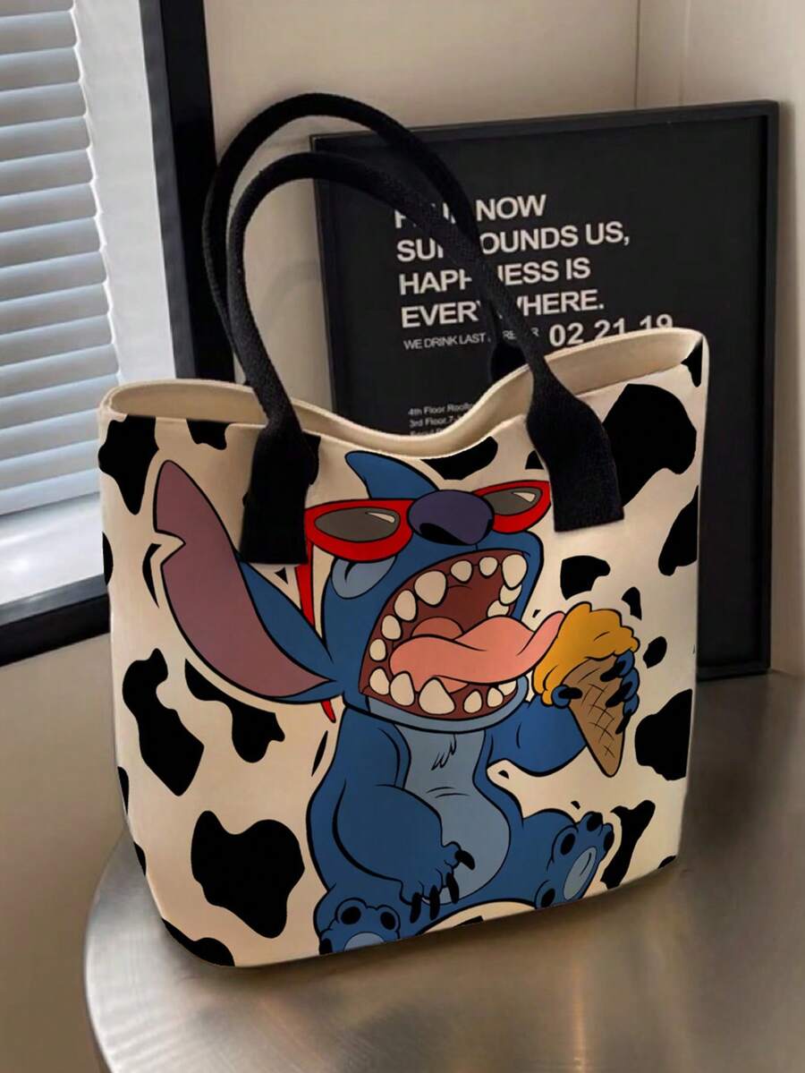 Cream tote bag with black cow spots and black handles showing cartoon Stitch in red sunglasses eating ice cream