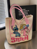 Cream tote bag with pink handles featuring Stitch and Angel pink graphics and large STITCH text