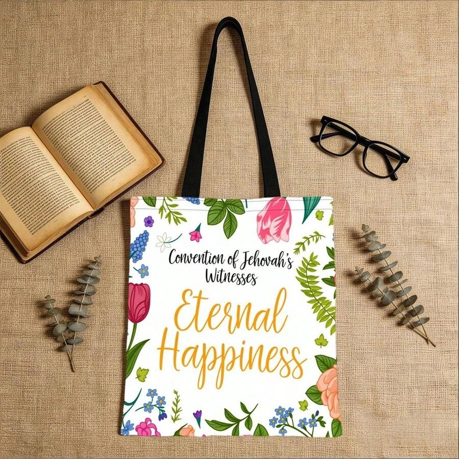 Flat lay front view of white floral Eternal Happiness convention tote bag with books