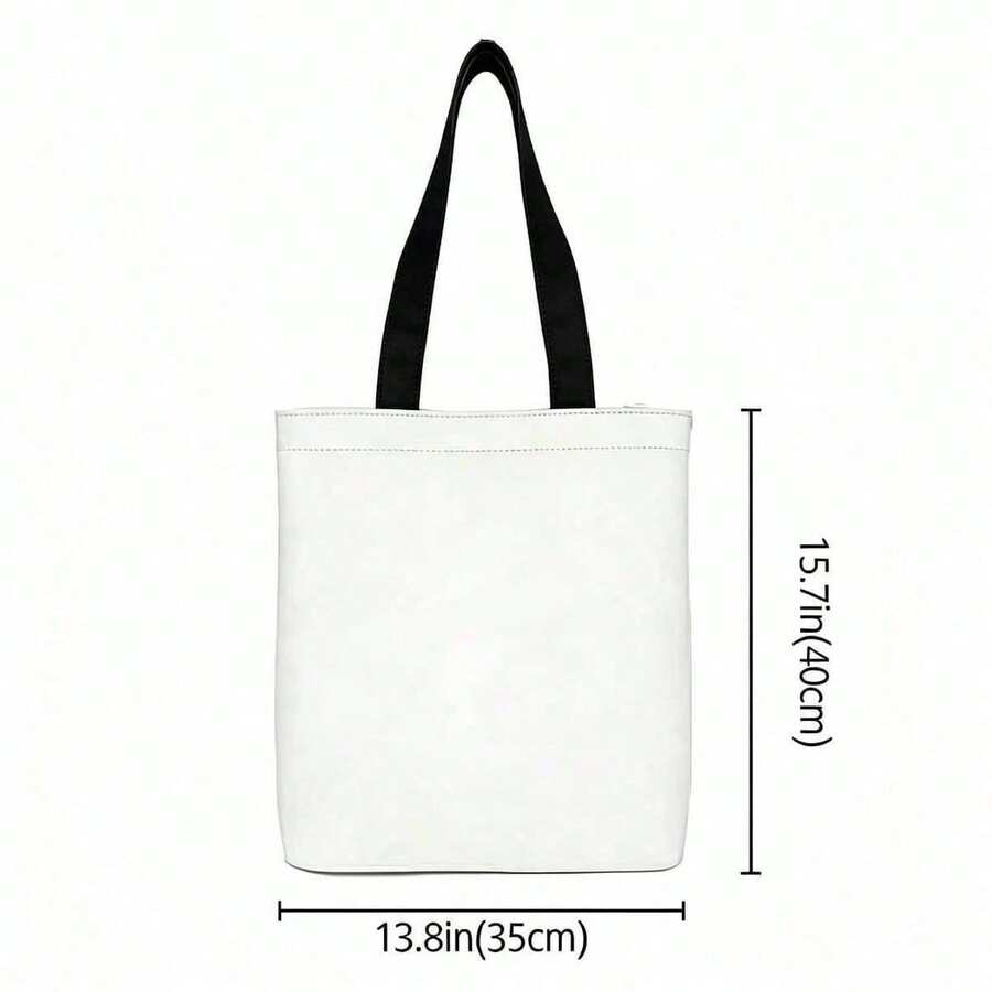 Back view of plain white canvas tote bag with black straps and size measurement