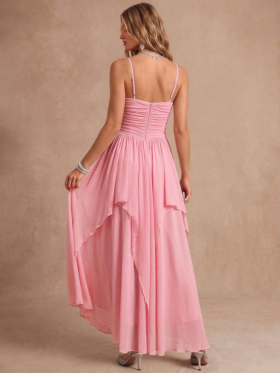 View 1 of baby pink ruched chiffon tiered maxi dress with thin straps, sweetheart neckline, asymmetric overlay skirt, wavy edges, and back zipper