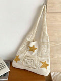 Indoor hanging view of cream crochet tote bag with yellow star patches