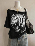 Front styled view of black oversized wide-neck T-shirt with roaring tiger graphic