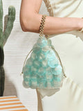 Blue mermaid scale shell handbag with overlapping translucent discs and gold drawstring