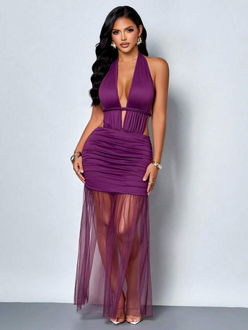 Front full-length view of purple halter bodycon maxi dress with sheer asymmetrical skirt