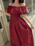 Close view of burgundy floral ruffled neckline and fitted midi dress