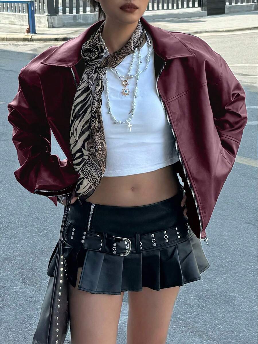 Front view of burgundy zip-front faux leather bomber jacket with pockets
