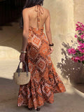 Back view rust orange paisley halter maxi dress with open back and neck tie