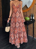 Rust orange paisley halter maxi dress with ruffle hem and woven handbag