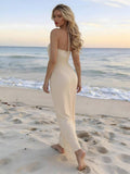 Champagne satin-look halter gown with gathered front panel and high slit