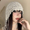 Cream crochet beaded headpiece shown flat with scalloped edge and pearl trim