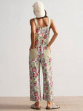 Back view of multicolor floral suspender jumpsuit with rear patch pockets