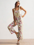 Full front view of multicolor floral suspender jumpsuit with loose fit
