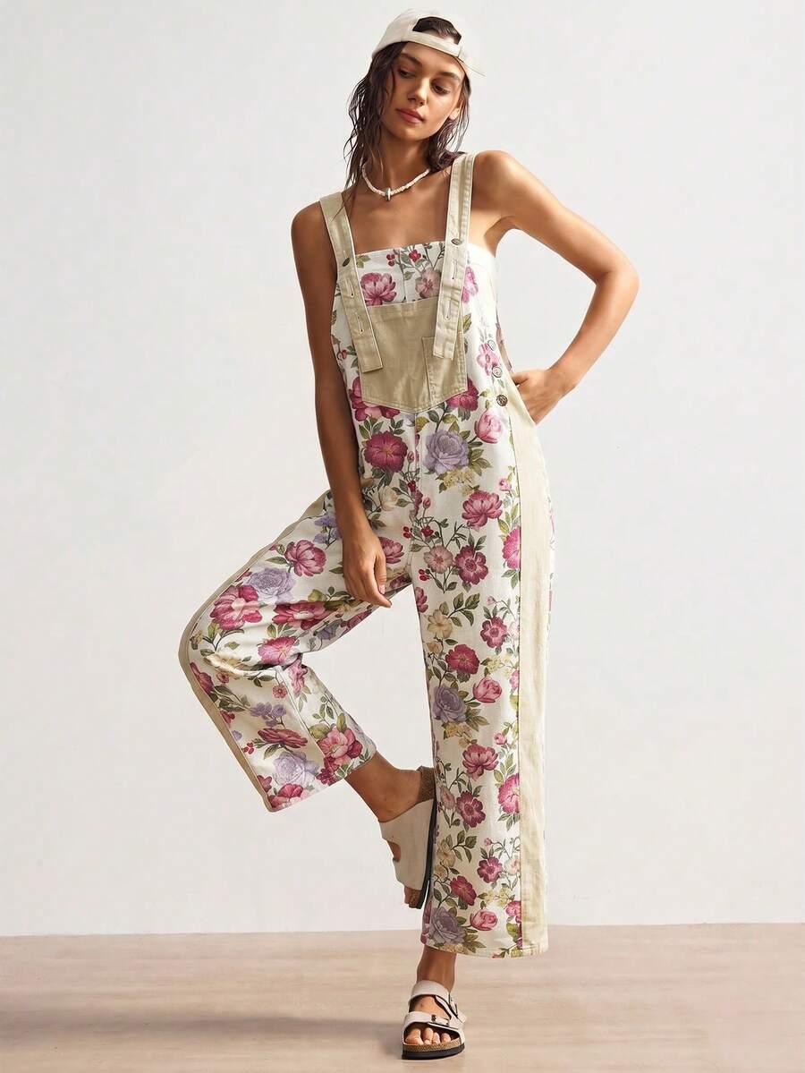 Full front view of multicolor floral suspender jumpsuit with loose fit