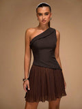 Dark brown one-shoulder mini dress with diagonal draped neckline and pleated skirt