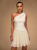 Ivory one-shoulder mini dress with diagonal draped neckline and pleated skirt
