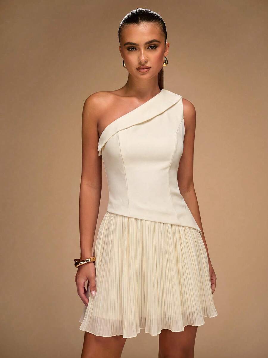 Ivory one-shoulder mini dress with diagonal draped neckline and pleated skirt