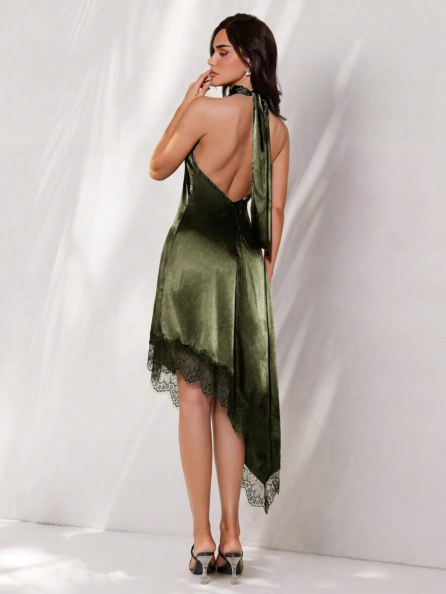 Back view of dark green satin halter mini dress with open back and long neck ties
