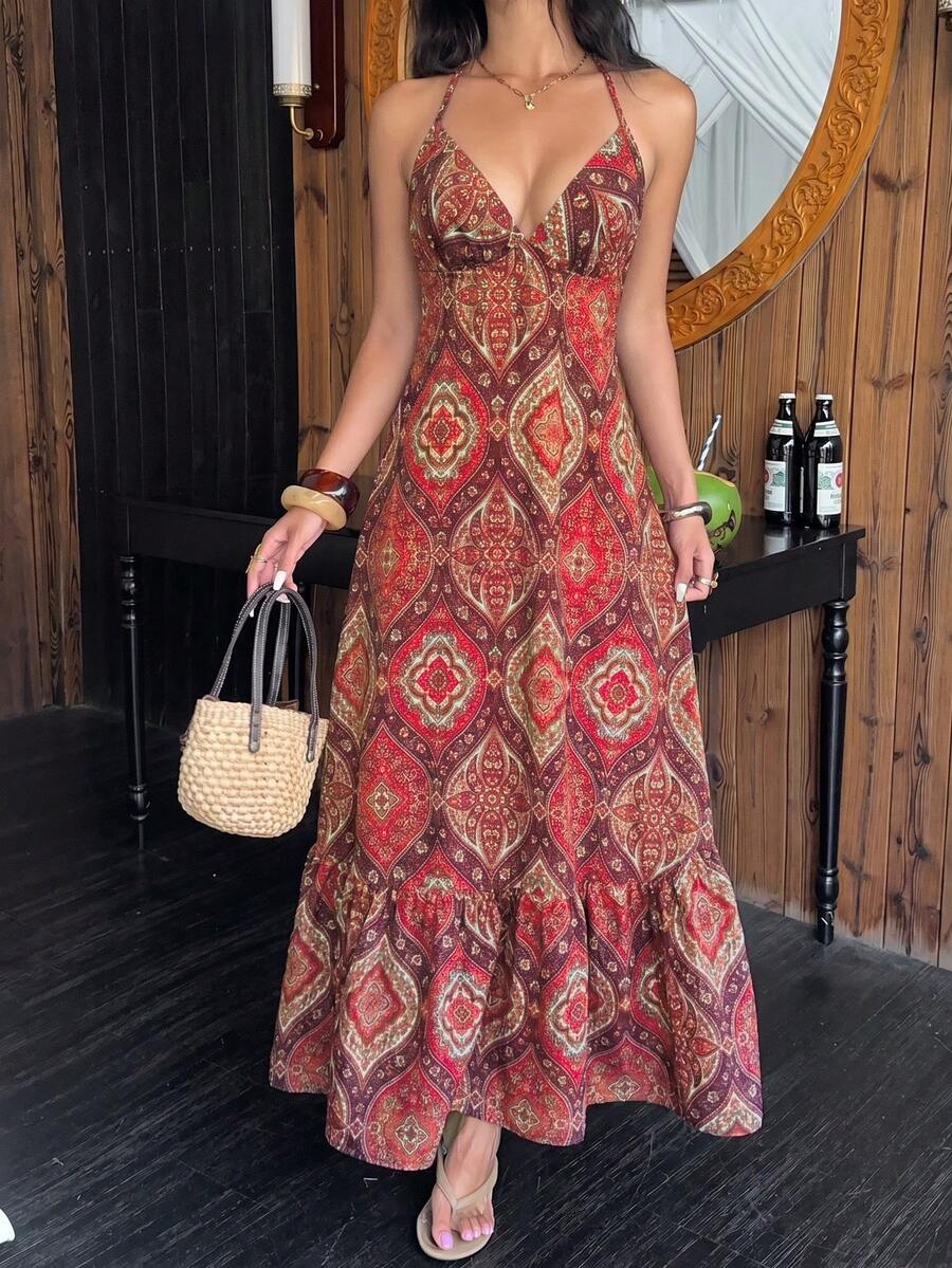 Red paisley halter maxi dress with ruffle hem and woven handbag