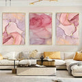 Three-piece abstract wall art displayed in a modern living room