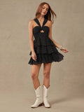 Back view of black and white halter ruffle mini dress