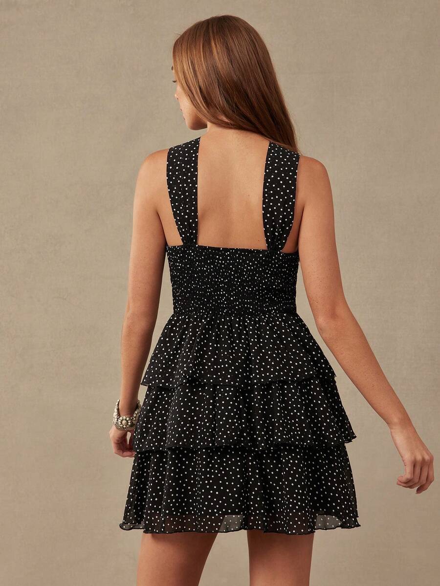 Front view of tiered ruffle polka dot mini dress with halter bow