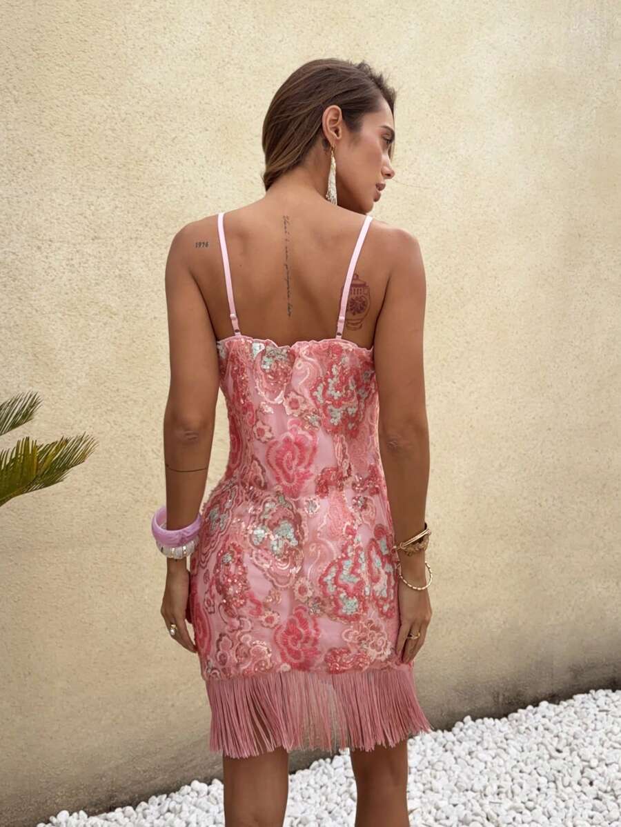 Side view of pink sequin fringe mini dress showing body-skimming cami shape and short hem