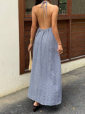 Capture effortless elegance with this blue plaid halter maxi dress, designed to blend classic charm with modern sophistication.