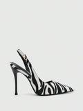 front view of black and white textured pointed-toe slingback pump