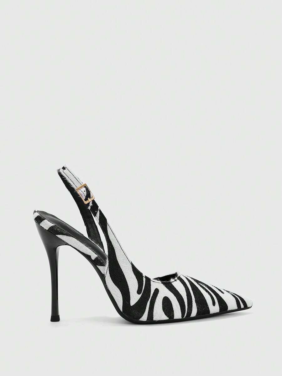front view of black and white textured pointed-toe slingback pump