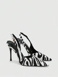 side view of black and white animal print slingback stiletto heel