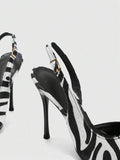 rear and side view of black and white slingback pump with buckle strap