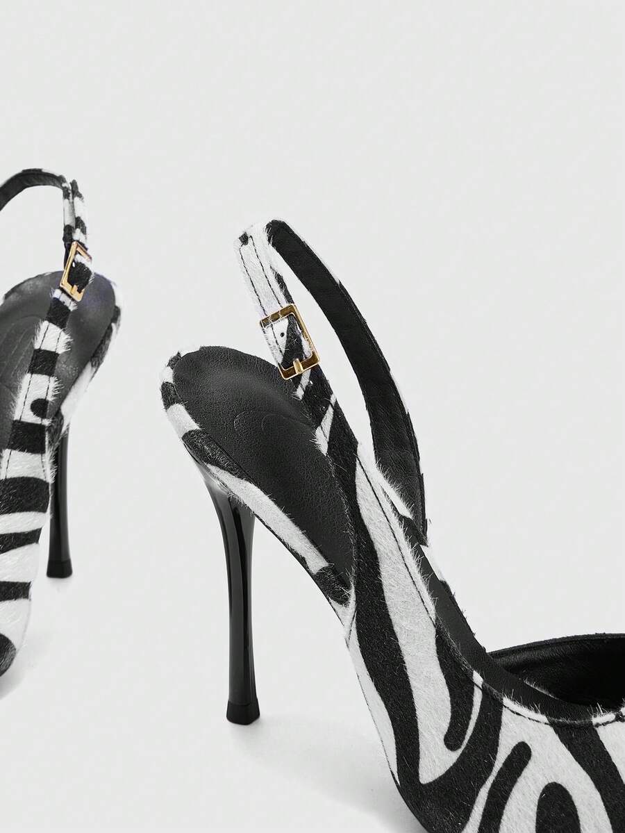 rear and side view of black and white slingback pump with buckle strap