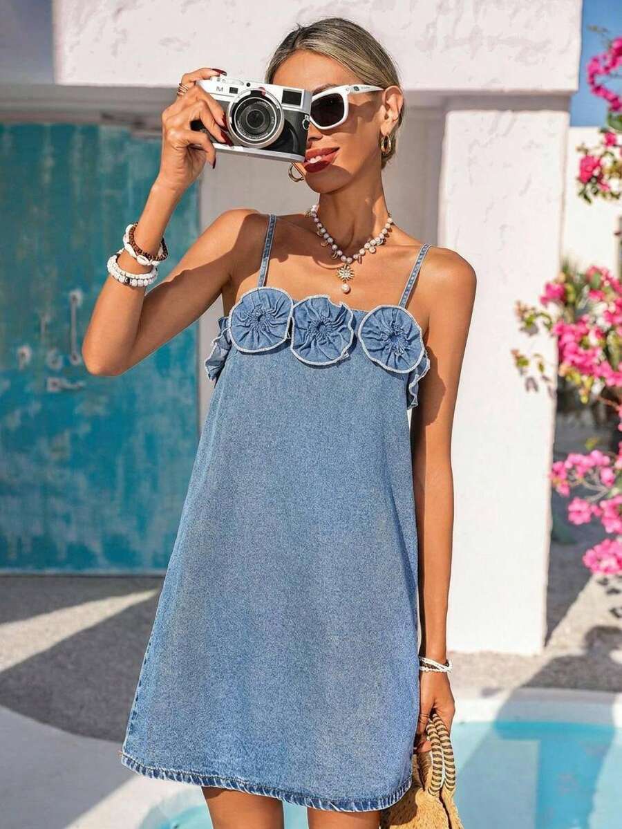 Full front view of floral appliqué denim cami mini dress by pool