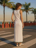 Back view of ivory fitted maxi dress with striped trim