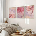 Close-up of pink marble artwork with gold accents