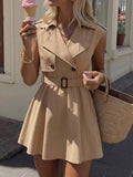 Khaki lapel mini dress styled with layered jewelry and woven handbag