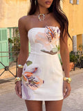 White sleeveless floral appliqué bodycon dress styled with gold jewelry