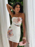 White strapless mini dress with raised flower appliqué and back zipper